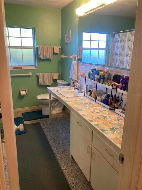 1126 Stevens Avenue DeLand, FL 32720 - Photo 18 of 38 a room with a washing machine and window