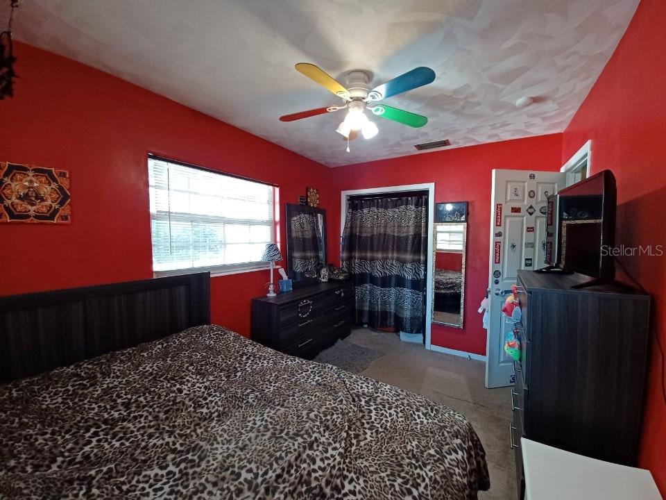 1126 Stevens Avenue DeLand, FL 32720 - Photo 20 of 38 a bedroom with a bed dresser and a window
