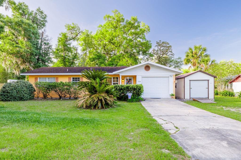 1126 Stevens Avenue DeLand, FL 32720 - Photo 2 of 38 front view of a house with a yard