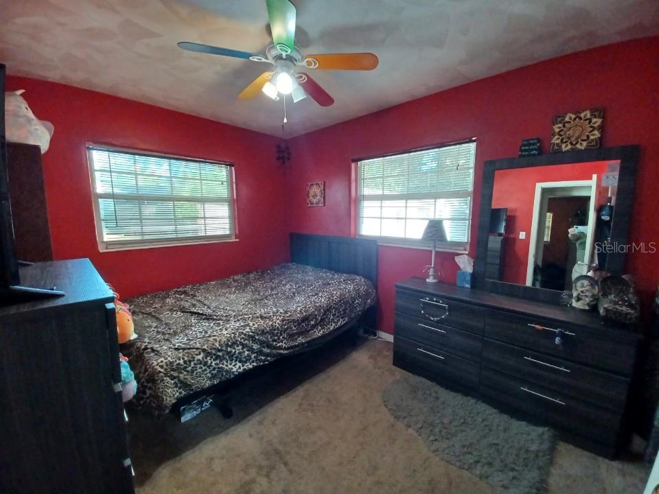 1126 Stevens Avenue DeLand, FL 32720 - Photo 21 of 38 a bedroom with a bed dresser and a window