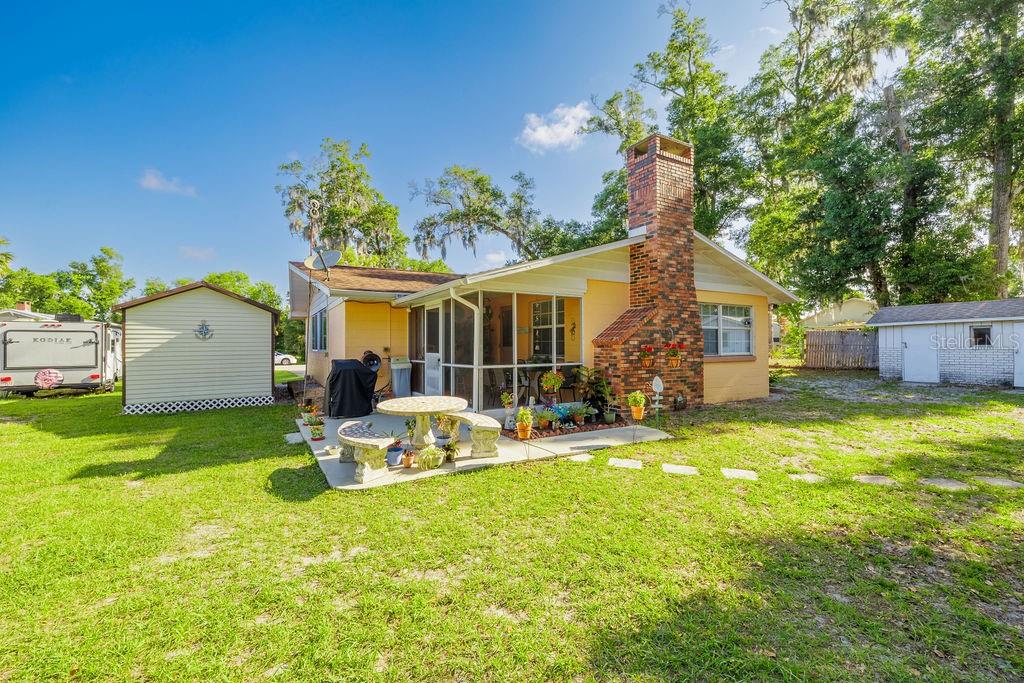 1126 Stevens Avenue DeLand, FL 32720 - Photo 28 of 38 a view of a house with backyard and sitting area