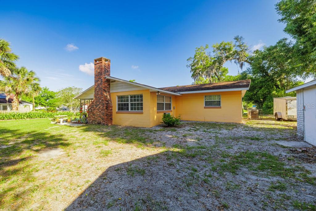 1126 Stevens Avenue DeLand, FL 32720 - Photo 29 of 38 a view of a house with backyard and tree