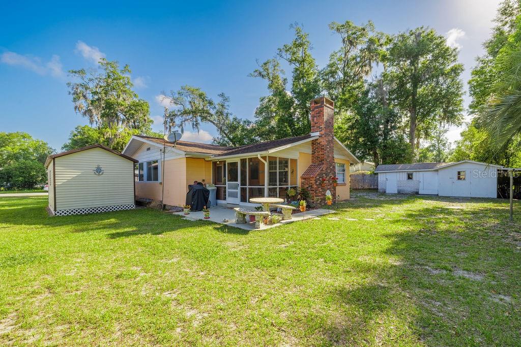 1126 Stevens Avenue DeLand, FL 32720 - Photo 31 of 38 a view of a house with backyard and sitting area