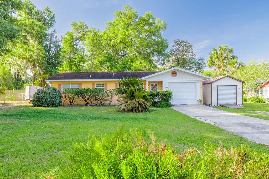 1126 Stevens Avenue DeLand, FL 32720 - Photo 33 of 38 a view of a house with backyard and garden