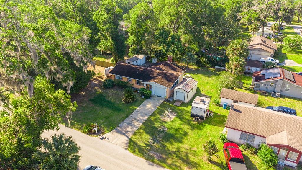 1126 Stevens Avenue DeLand, FL 32720 - Photo 36 of 38 an aerial view of a house with a garden and swimming pool
