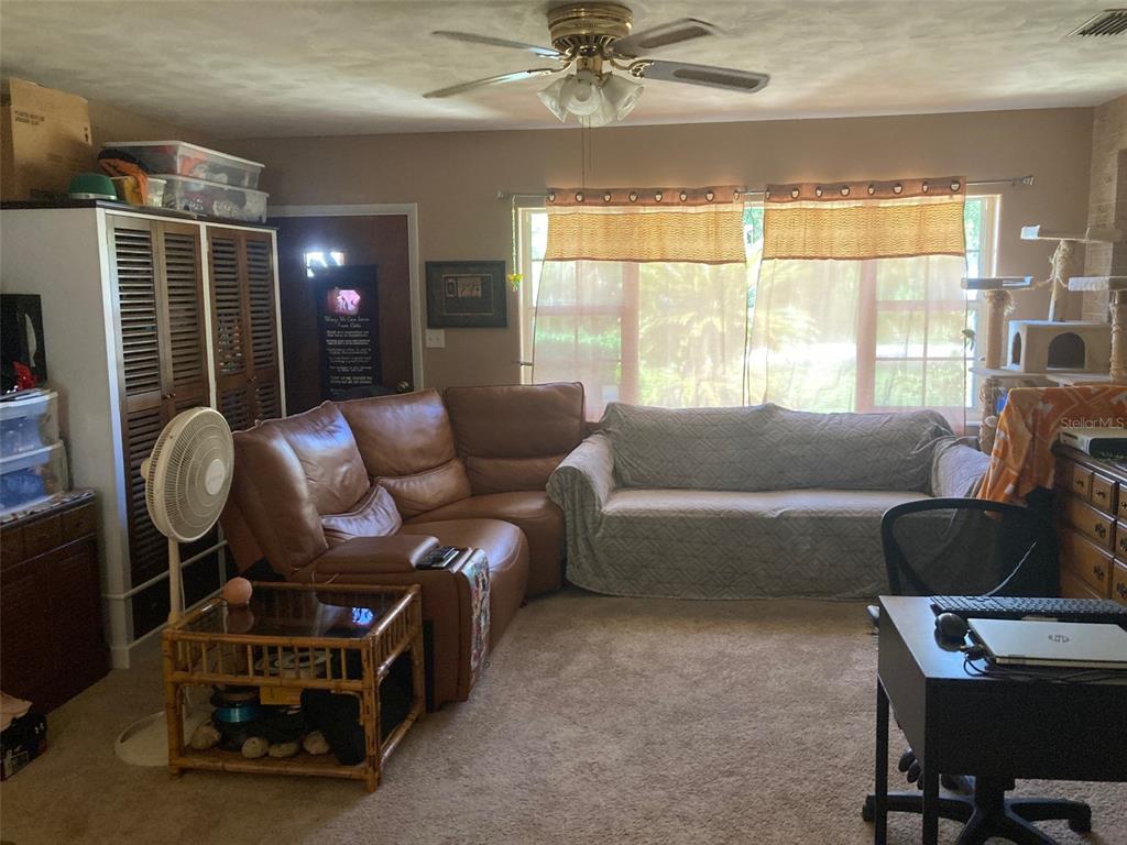 1126 Stevens Avenue DeLand, FL 32720 - Photo 4 of 38 a living room with furniture and a window