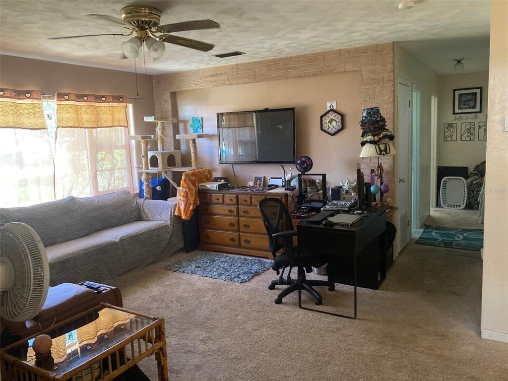 1126 Stevens Avenue DeLand, FL 32720 - Photo 5 of 38 a living room with furniture and a window