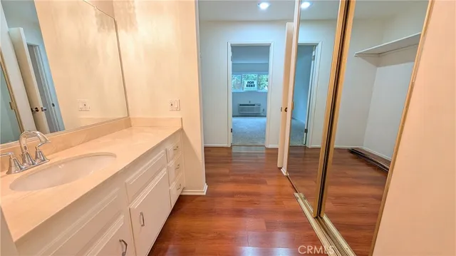a bathroom with a sink and a large mirror