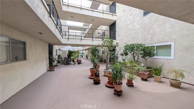 a view of a bedroom with painting on the wall