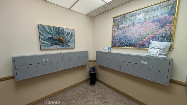 a view of a chairs and table in the patio and a fountain