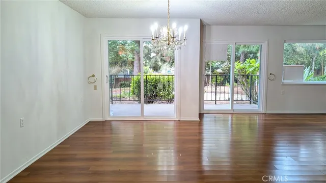 a view of a room with window wooden floor and garden view