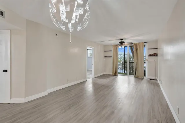 a view of a livingroom with wooden floor