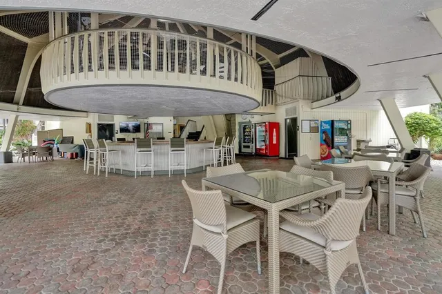 a view of a dining table and chairs in the patio