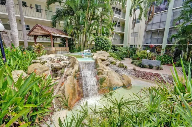 a view of yard with swimming pool and outdoor seating