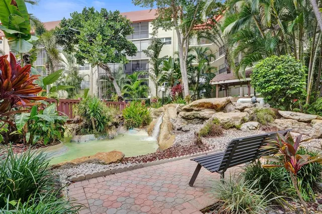 a view of backyard of house with outdoor seating