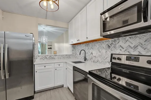 a kitchen with a stove microwave and refrigerator