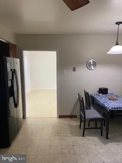 a workspace room with furniture and a window