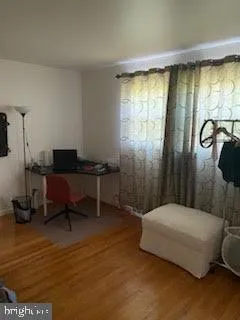 a bedroom with a bed and a table in it