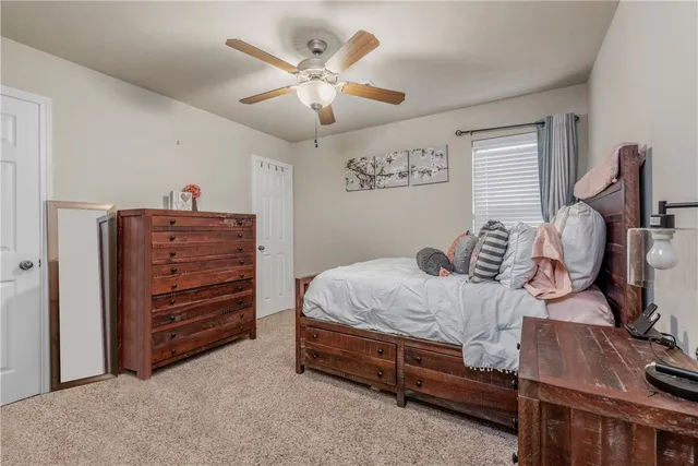 a bed room with a bed and a chandelier