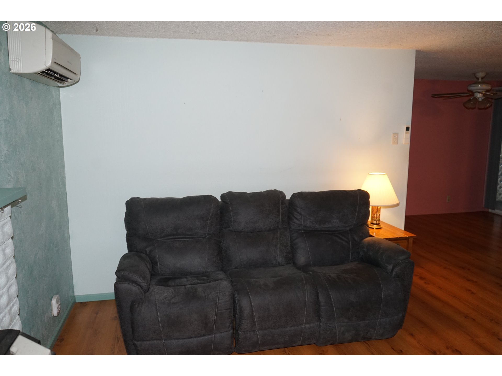 802 54th Place Springfield, OR 97478 - Photo 4 of 27 a couch sitting in a room next to a window