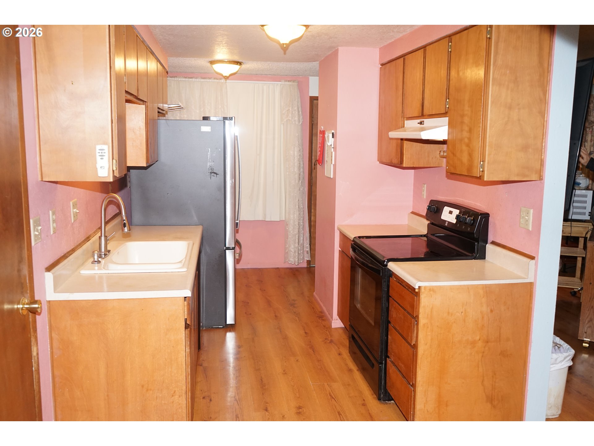 802 54th Place Springfield, OR 97478 - Photo 6 of 27 a bathroom with a sink a toilet and mirror