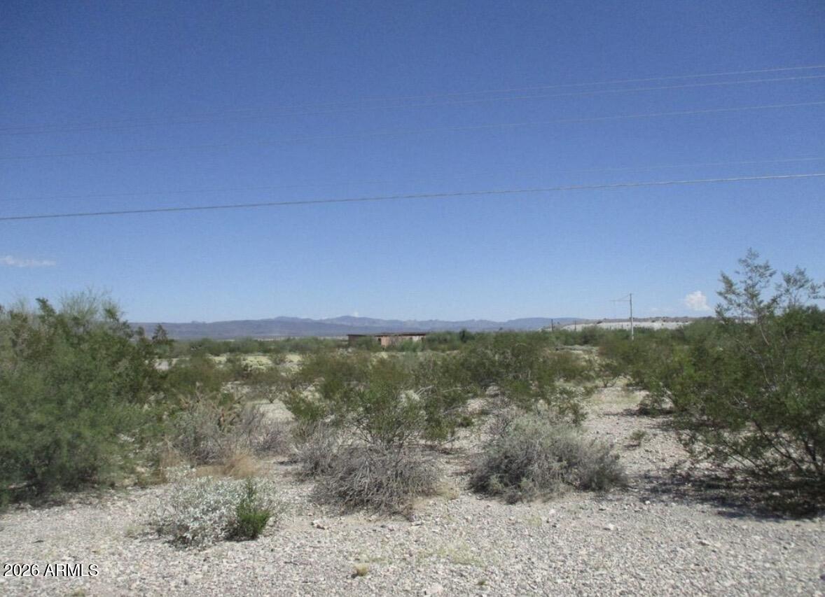 1940 North 2nd Avenue, Unit NULL Ajo, AZ 85321 - Photo 8 of 10 a view of a lake with a building in the background