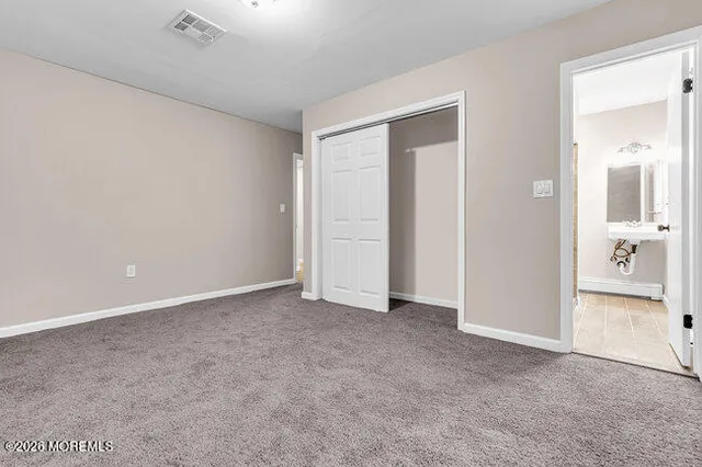 an empty room with a bathroom