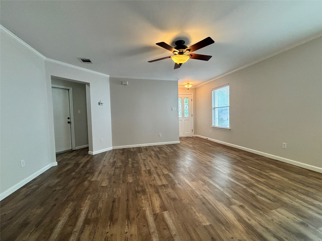 1702 McDowell Bend Leander, TX 78641 - Photo 2 of 13 a view of empty room with wooden floor and fan