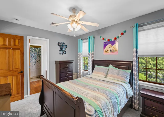a utility room with dryer washer and a flat screen tv