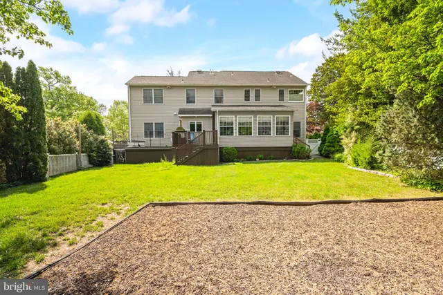 a view of house with a yard