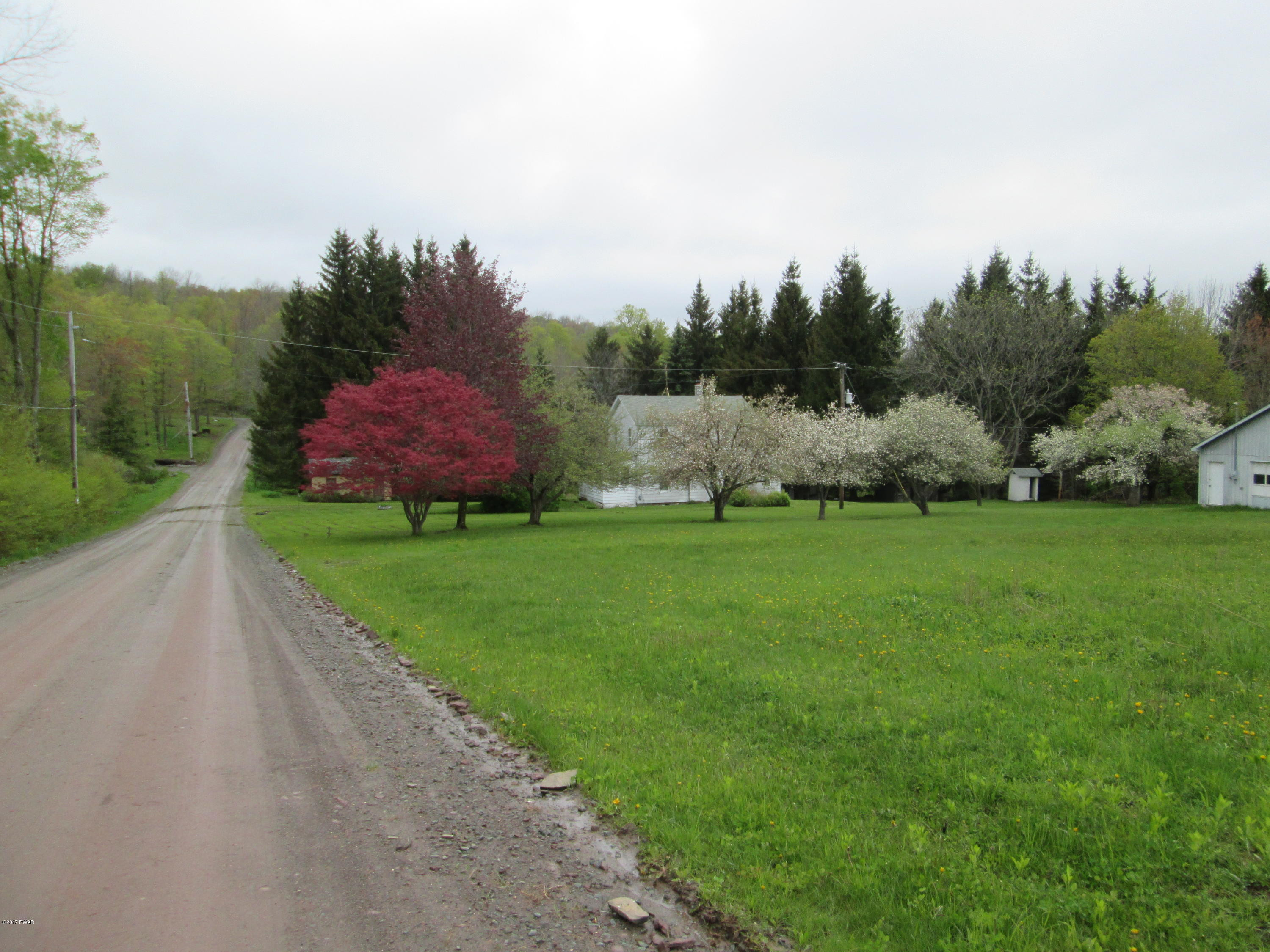 86 Beaver Hollow Road Lakewood, PA 18439 - Photo 2 of 30 a view of a garden with trees