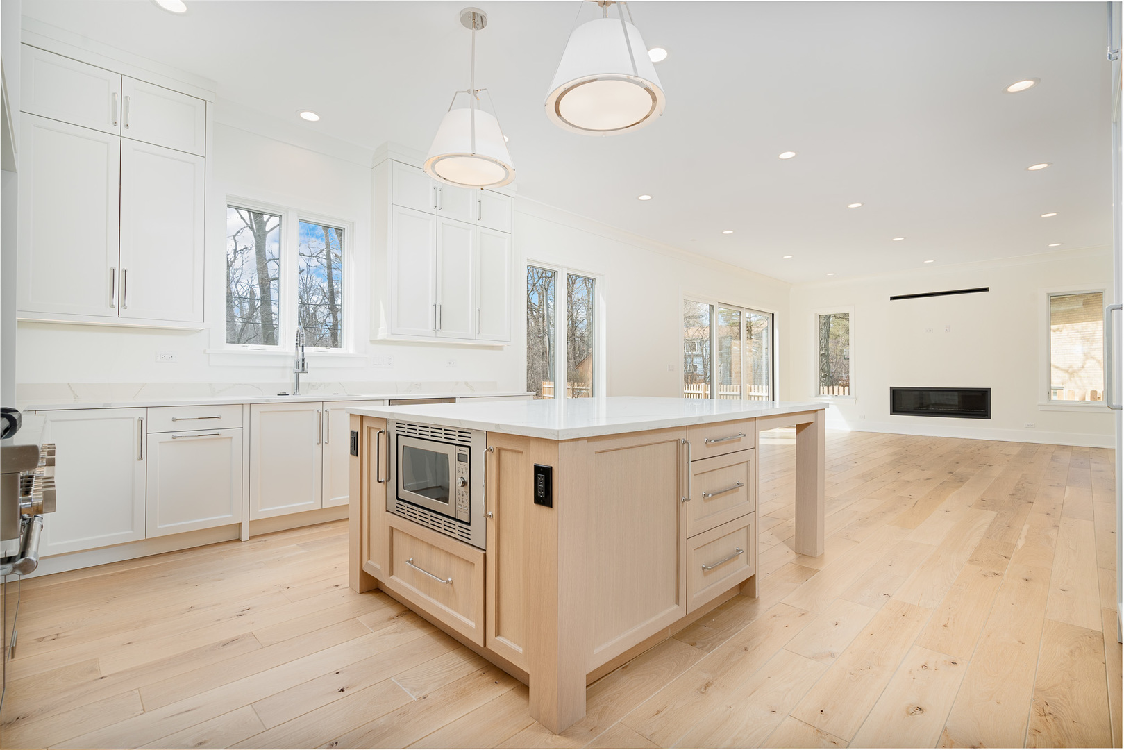 2421 Sumac Circle Glenview, IL 60025 - Photo 2 of 27 a kitchen with stainless steel appliances granite countertop white cabinets and window