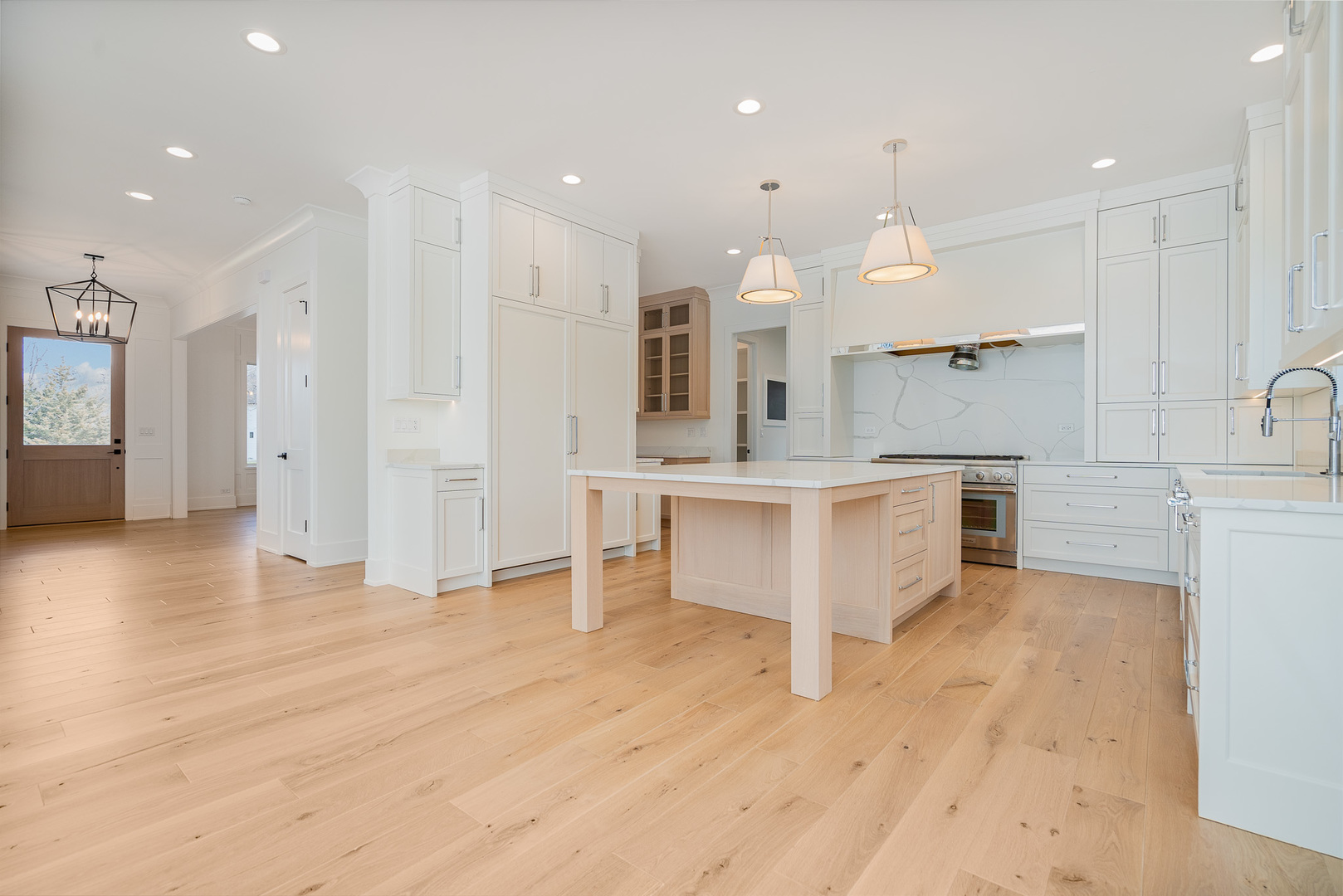 2421 Sumac Circle Glenview, IL 60025 - Photo 4 of 27 a large white kitchen with lots of counter space and appliances