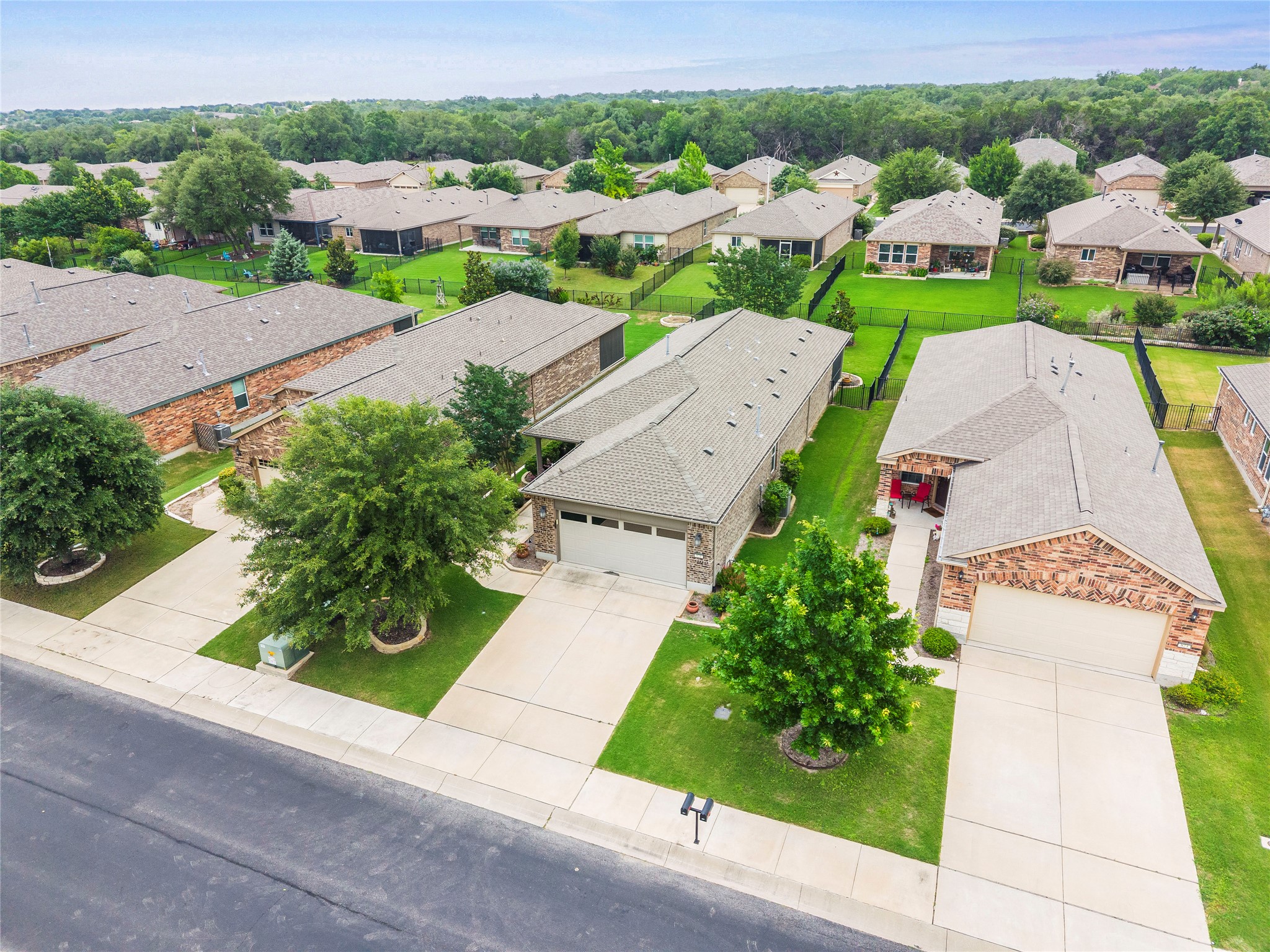 821 Hamilton Lane Georgetown, TX 78633 - Photo 26 of 38 brick facades, attached garages, and concrete driveways