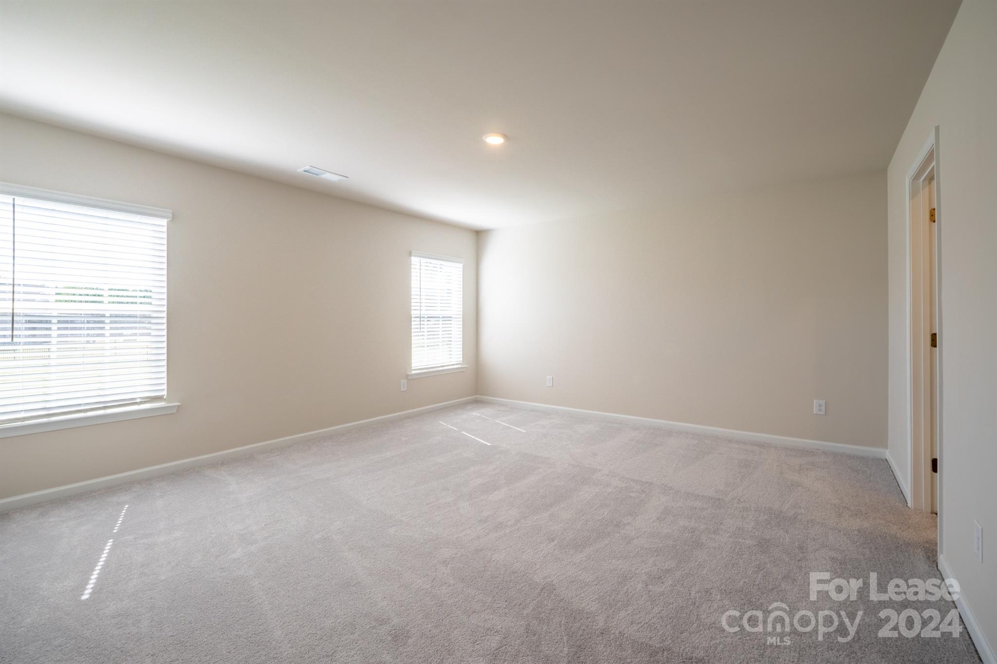 15307 Lake Ridge Road Charlotte, NC 28278 - Photo 23 of 33 an empty room with windows