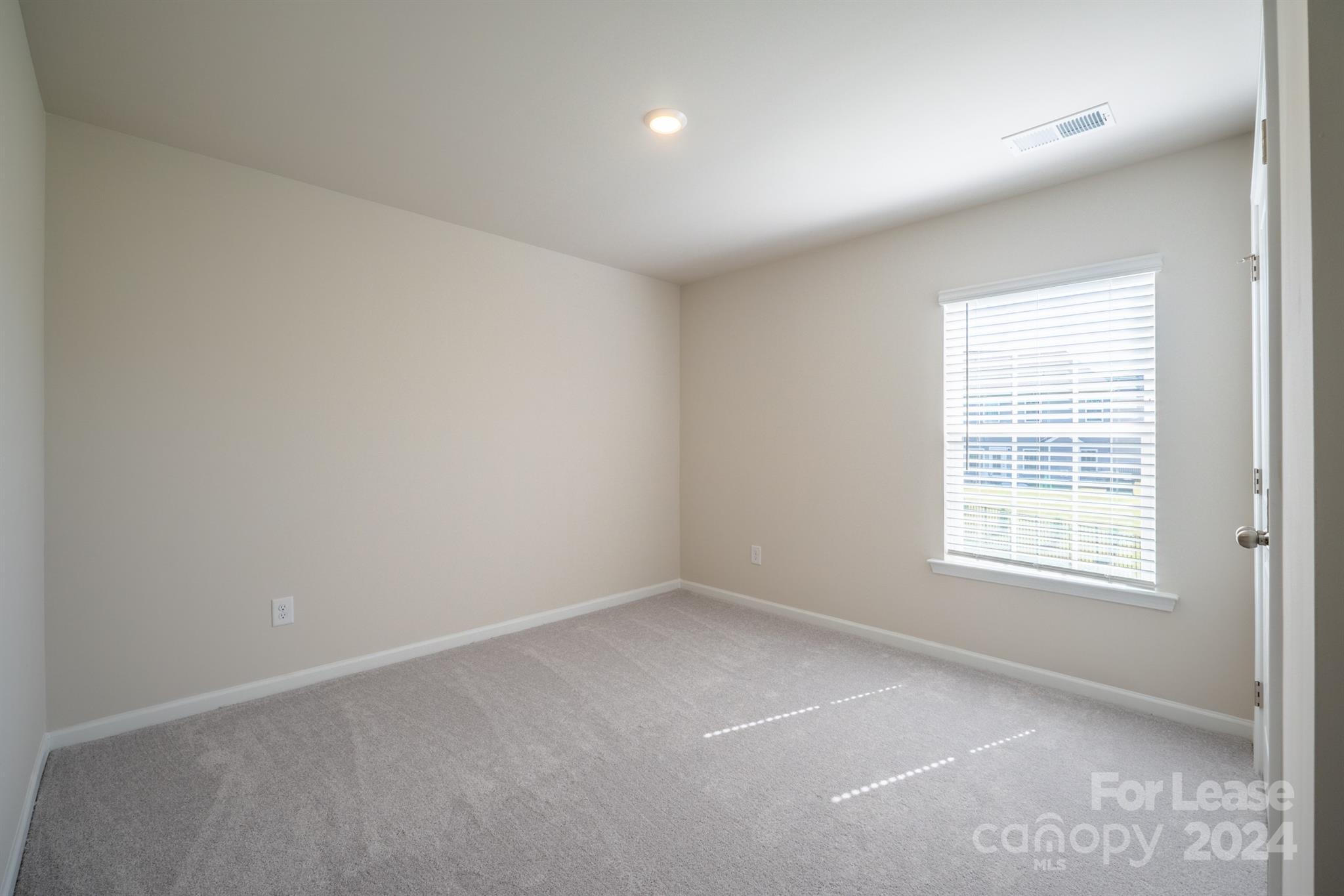 15307 Lake Ridge Road Charlotte, NC 28278 - Photo 24 of 33 an empty room with a window