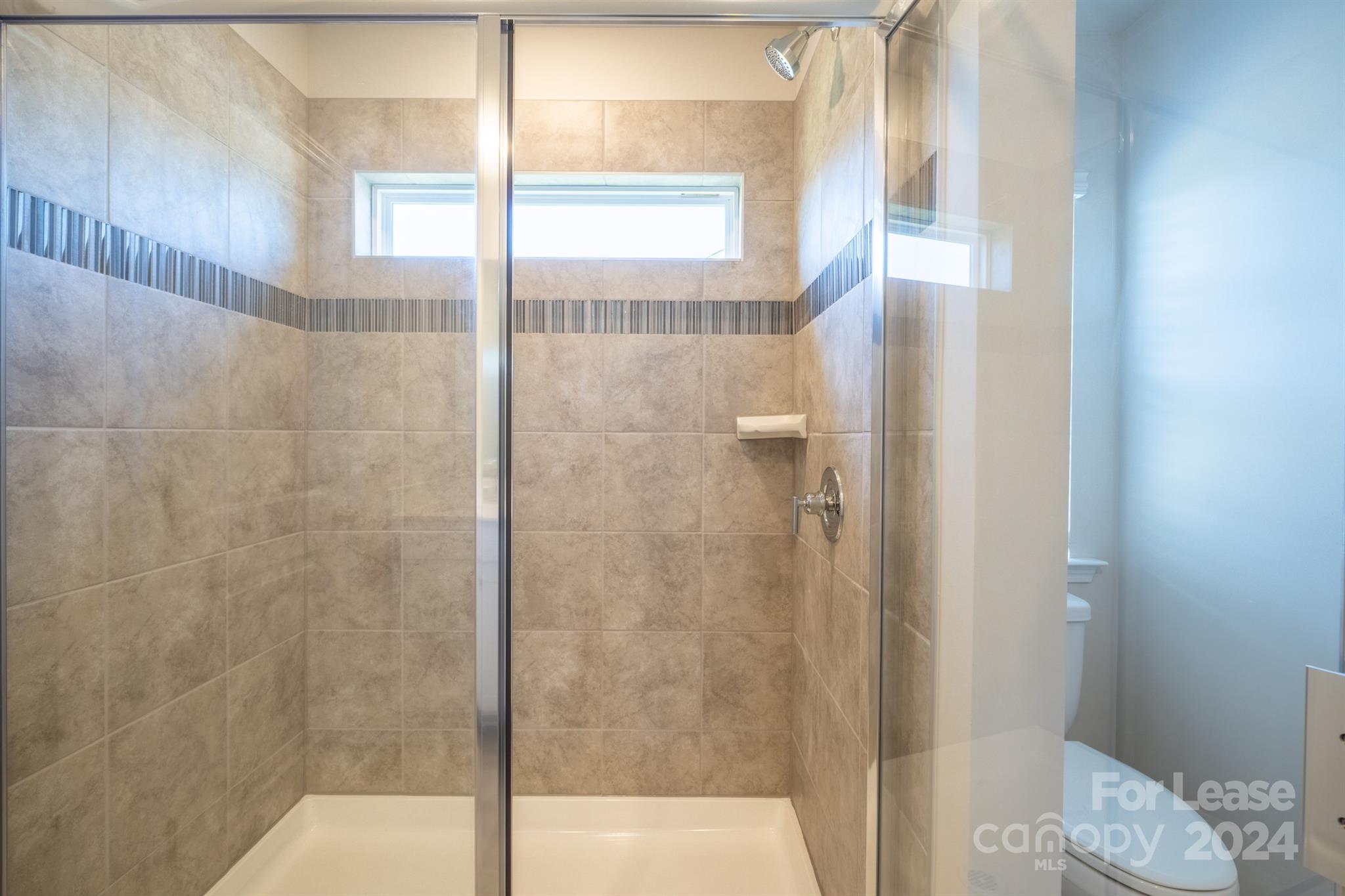 15307 Lake Ridge Road Charlotte, NC 28278 - Photo 30 of 33 a bathroom with a shower