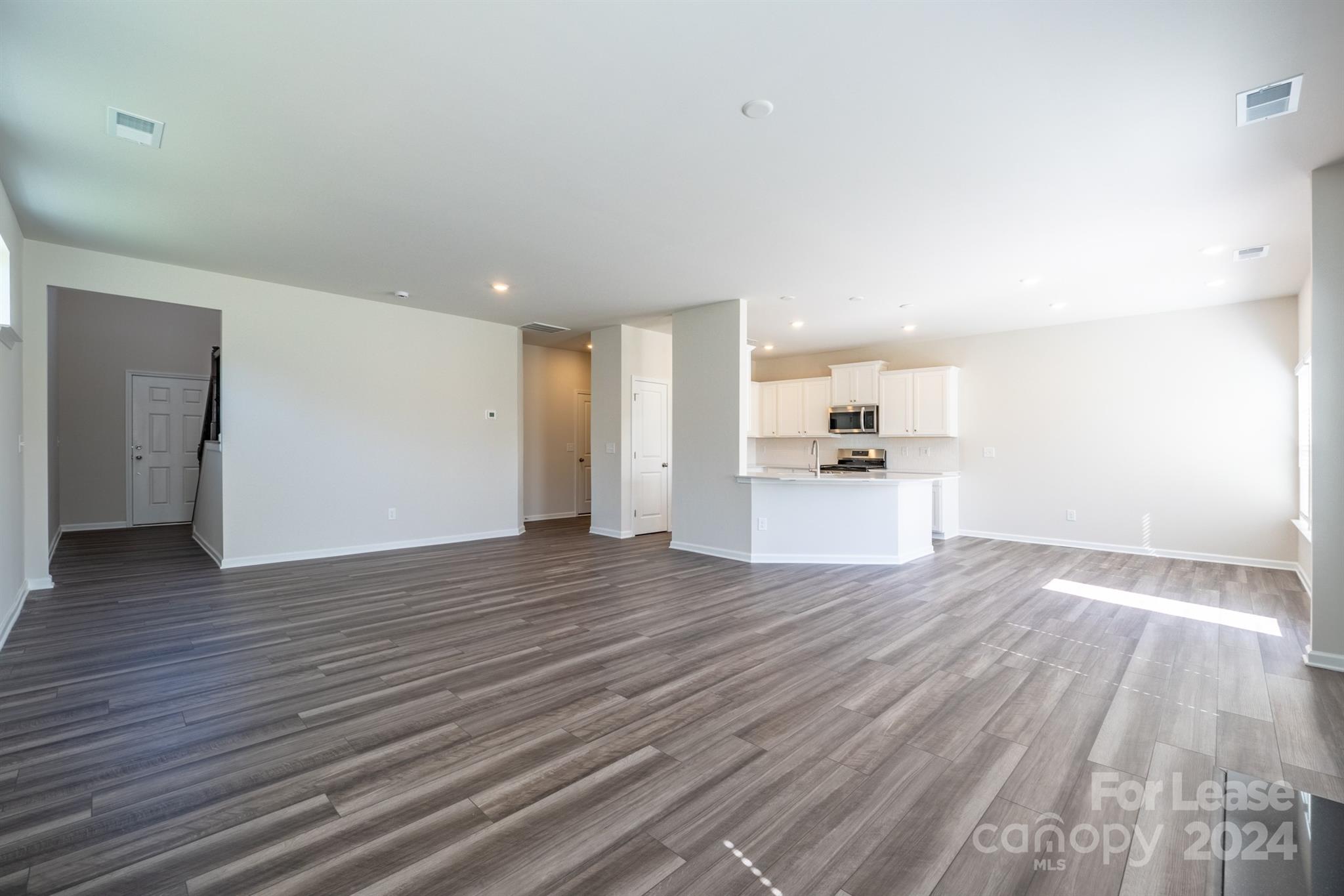15307 Lake Ridge Road Charlotte, NC 28278 - Photo 5 of 33 a view of a livingroom with wooden floor