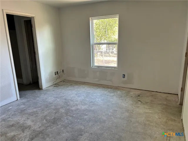 an empty room with windows