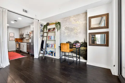 a view of a livingroom with workspace and workspace