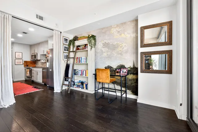 a view of a livingroom with workspace and workspace