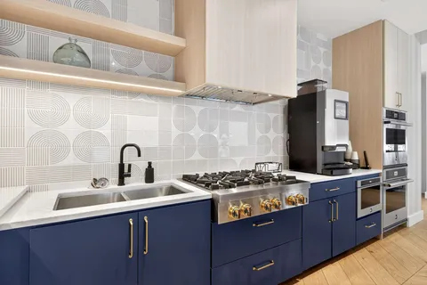 a living room with fireplace furniture and a flat screen tv