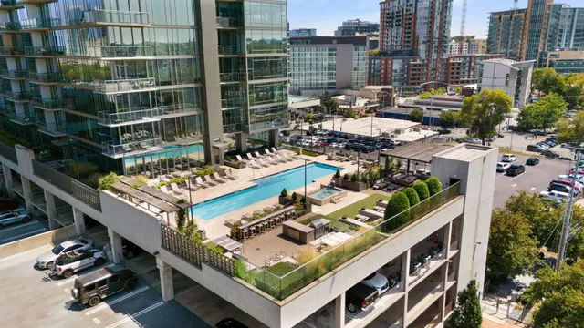 a kitchen with kitchen island granite countertop wooden cabinets and a refrigerator