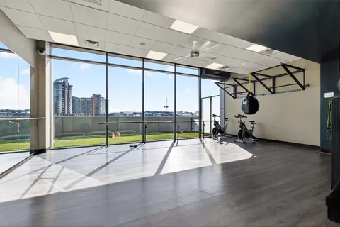 a view of a swimming pool with outdoor seating