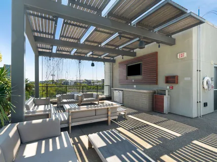 a swimming pool with outdoor seating and yard