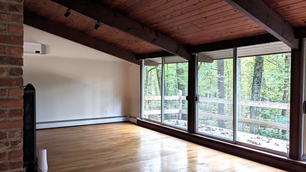 41 Belvedere Road Boxford, MA 01921 - Photo 6 of 16 a view of empty room with wooden floor and fan