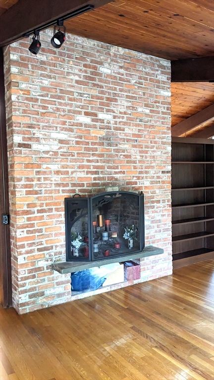 41 Belvedere Road Boxford, MA 01921 - Photo 7 of 16 a view of empty room with fireplace and wooden floor