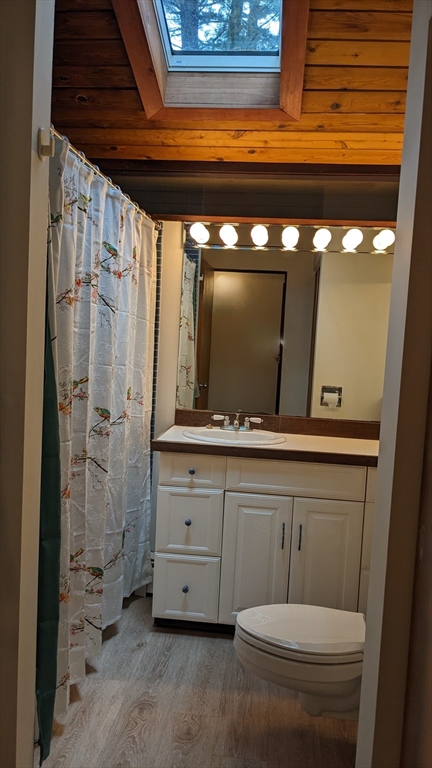 41 Belvedere Road Boxford, MA 01921 - Photo 9 of 16 a bathroom with a toilet a sink and mirror