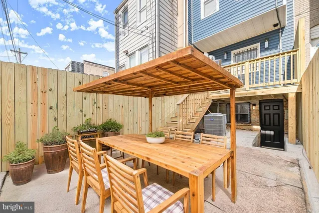 a patio with a table and chairs