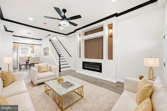a living room with furniture and a rug